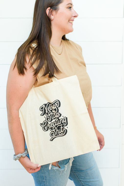Never Stop Creating Shit Tote Bag by Manor Paper Co.